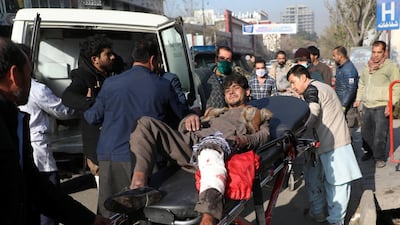 An injured man is carried to a hospital after rockets hit residential areas in Kabul, Afghanistan. REUTERS