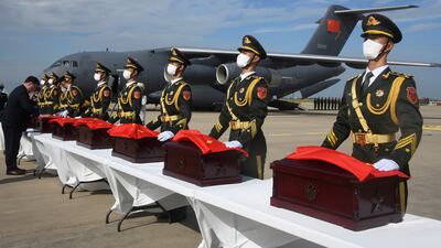 Chinese soldiers with caskets containing the remains of Chinese soldiers who were killed in the 1950-1953 Korean War during the handing over ceremony at Incheon International Airport in South Korea. AP
