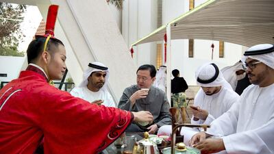 Chang Hua, ambassador of China to the UAE, enjoys dinner with students in the UAE Youth Ambassadors Programme. Wam