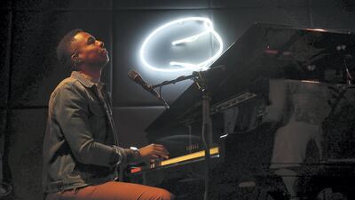 David Davis, The US pianist and singer performing with his band members at the Qs bar at the Palazzo Versace hotel in Dubai. Pawan Singh / The National