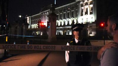 A man armed with a knife was detained outside London’s Buckingham Palace Friday evening, and two police officers were injured while arresting him, police said. Lauren Hurley/PA via AP