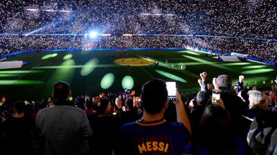 Barcelona fans attend a tribute for Andres Iniesta at the end of the match. Josep Lago / AFP