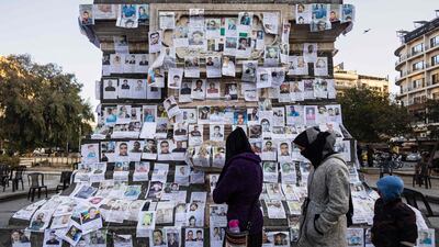 Posters of the missing on a monument in Marjeh Square, Damascus, Syria. AFP