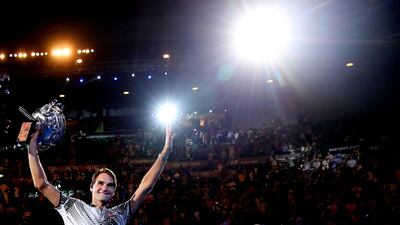 Federer of Switzerland waves to fans after his 2017 triumph. Getty