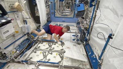 Canadian Space Agency astronaut Robert Thirsk, Expedition 20 flight engineer, inserts urine samples into the ISS Laboratory Freezer as part of the Nutritional Status Assessment study. Wikicommons