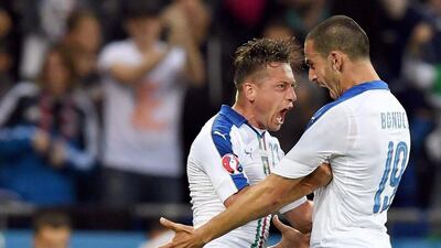 Italy’s Emanuele Giaccherini (L) celebrates with his teammate Leonardo Bonucci after scoring the opening goal during the Uefa Euro 2016 group E preliminary round match between Belgium and Italy at Stade de Lyon in Lyon, France, 13 June 2016. Daniel Dal Zennaro / EPA