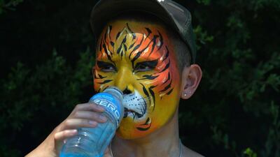 A spectator cools off at the second day of the Australian Open in Melbourne. Paul Crock / AFP