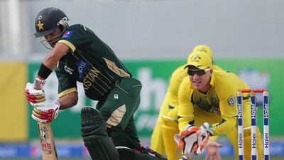 Pakistani batsman Ahmed Shehzad hits the ball during the second one day international match between Australia and Pakistan in Dubai, United Arab Emirates, Friday, Oct. 10, 2014. AP Photo/Kamran Jebreili