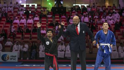 Hamad Eissa Al Balooshi, left, celebrates his win in the Abu Dhabi World Para Jiu-Jitsu Championship. Mona Al Marzooqi / The National