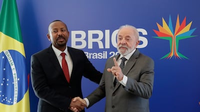 Mr da Silva greets Prime Minister of the Federal Democratic Republic of Ethiopia Abiy Ahmed Ali. AP