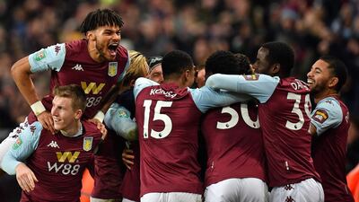 Aston Villa players celebrate after Trezeguet scores the winning goal. AFP