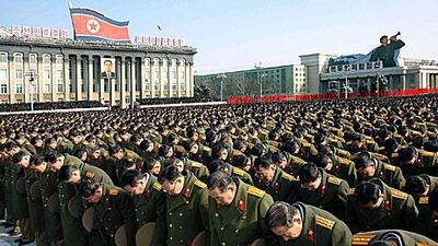 Military personnel observe a silent prayer over the late North Korea leader, Kim Jong-il, as his son, Kim Jong-un was declared 'Supreme Leader' today.