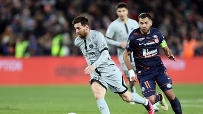 Paris Saint-Germain's Argentine forward Lionel Messi fights for the ball with Montpellier's French midfielder Teji Savanier. AFP