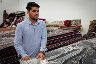 Abdullah Zarify displays handmade rugs at Watan Market in Richmond, Virginia. Joshua Longmore / The National