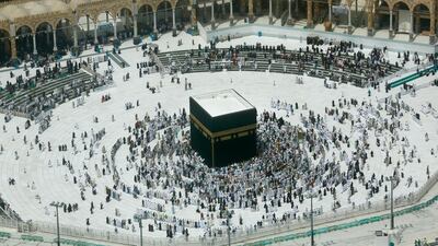 A relatively few number of Muslims pray around the Kaaba, the cubic building at the Grand Mosque, in the Muslim holy city of Makkah, Saudi Arabia, Wednesday, March 4, 2020. AP
