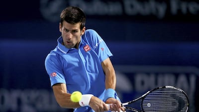 Novak Djokovic of Serbia plays a backhand against Marsel Ilhan of Turkey during their quarter-final match at the Dubai Duty Free Tennis Championships on February 26, 2015. Francois Nel/Getty Images