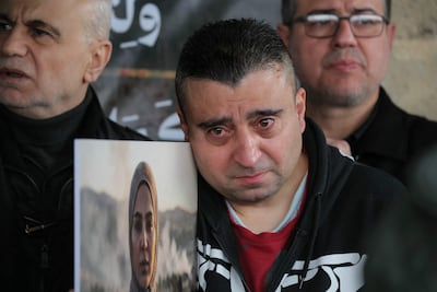 Mourners gather in the Choueifat area on the outskirts of Beirut during the funeral of journalists killed in an Israeli strike. AFP