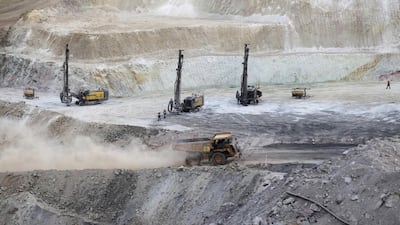 Trucks ferry excavated copper ore from the pit at the Bisha Mining Share Company in Eritrea. Chinese imports of copper have surged. Thomas Mukoya/Reuters