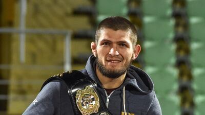 Khabib Nurmagomedov carries his UFC championship belt. AFP