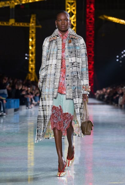 Dresses need not disappear for the season: fine layers, tall boots and tailoring can carry them into the cooler months. Photo: Chanel