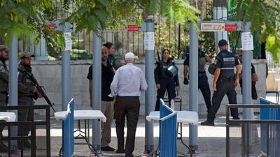 A Palestinian worshipper passes through metal detectors installed by Israel at the entrance to Al Aqsa compound in Jerusalem on July 22, 2017. Atef Safati /EPA