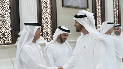 Sheikh Mohamed bin Zayed, Crown Prince of Abu Dhabi and Deputy Supreme Commander of the Armed Forces, greets Dr Mugheer Al Khaili, chairman of the newly announced Department of Community Development. Rashed Al Mansoori / Crown Prince Court - Abu Dhabi