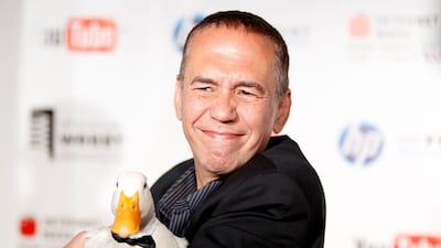 FILE PHOTO: Comedian Gilbert Gottfried arrives with a duck at the Webby Awards in New York June 14, 2010. REUTERS / Lucas Jackson / File Photo