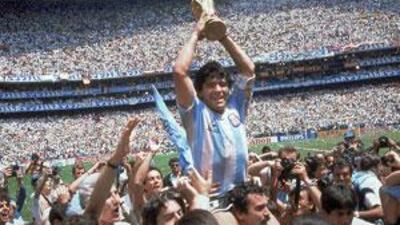 Argentina's Diego Maradona holds up the World Cup Trophy after his side defeated West Germany in the 1986 World Cup final.