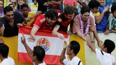 Tahiti players shake hands with fans at the Maracana in Rio de Janeiro before their Confederations Cup game with Spain.