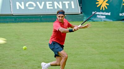 Roger Federer plays a backhand to Ilya Ivashka during their Halle Open first round match. Getty Images