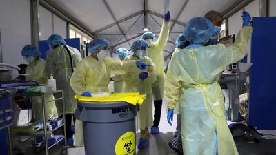 Medical staff inside a Covid-19 screening centre at Cleveland Clinic Abu Dhabi. Reuters
