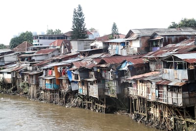 Houses along the banks of the Ciliwung River in Jakarta, Indonesia. The pandemic pushed about 70 million people into extreme poverty in 2020. EPA