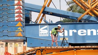 A worker takes measurement at a construction site of the Riyadh Metro. Fayez Nureldine / AFP