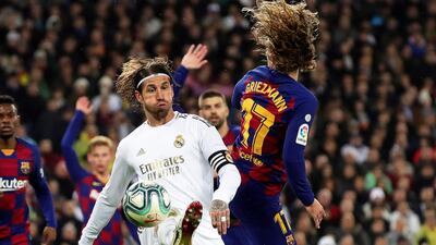 Real Madrid's Sergio Ramos (L) in action against Barcelona's Antoine Griezmann. EPA