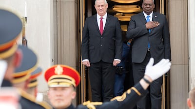 US Defence Secretary Lloyd Austin, right, and Israeli Defence Minister Benny Gantz stand for the national anthems of their countries before a meeting at the Pentagon in Washington. AFP