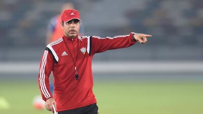 Mahdi Ali speaks to his players during a UAE national football team training session prior to their World Cup qualifier against Malaysia. UAE FA / Courtesy