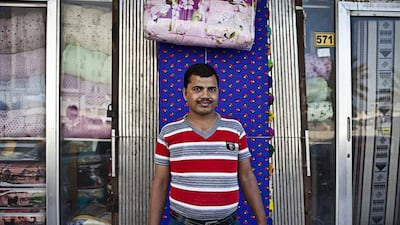 Ganesh Pandey, a salesman of a mobile accessories shop near the Msheirab Neighbourhood construction site. The working-class community of largely South Asian and Filipino men still carries the quaint if somewhat gritty charm of other melting-pot areas in the Gulf, such as Dubai’s Deira neighbourhood.
