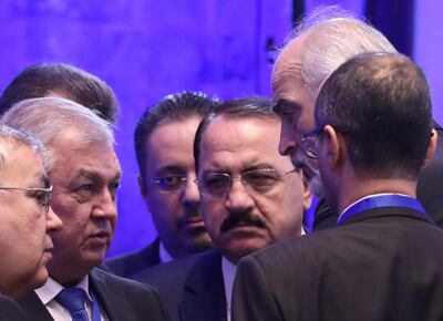 Russia's Special Envoy to Syria Alexander Lavrentiev speaks with Syria's UN Ambassador Bashar AL Jaafari during Syria peace talks in Astana. Reuters