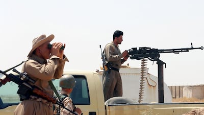 Iraqi Kurdish forces take position as they fight jihadist militants from ISIL in the Iraqi village of Bashir. Photo: Karim Sahib / AFP