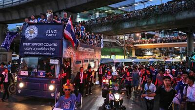 A bus carrying Leicester City players drives its way through a crowd during an open-top bus parade through the streets of Bangkok, Thailand. Dario Pignatelli / Bloomberg