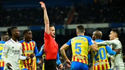 Referee Javier Alberola Rojas shows Valencia defender Gabriel Paulista a red card for fouling Real Madrid's Vinicius Junior. AFP