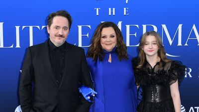 Ben Falcone, left, McCarthy, centre, and their daughter Vivian at the world premiere. AFP