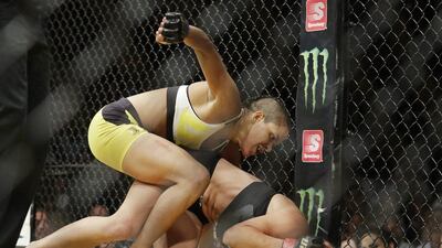 Amanda Nunes, left, fights Miesha Tate during their women's bantamweight bout at UFC 200, Saturday, July 9, 2016, in Las Vegas. John Locher / AP Photo