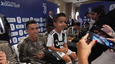 Cristiano Ronaldo of Juventus signing autographs during a meet and greet in Jeddah. Getty Images