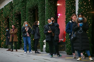 Shoppers queue to enter Selfridges department store . Bloomberg
