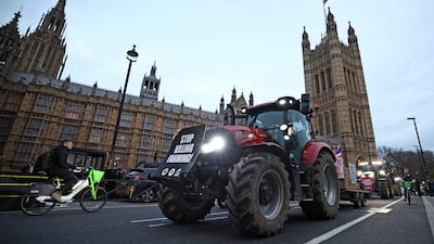 Farmers drive tractors past parliament during a demonstration against UK food policy earlier this year. AFP