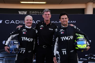 Cadillac team principal Graeme Lowdon with drivers Valtteri Bottas, left, and Sergio Perez. PA