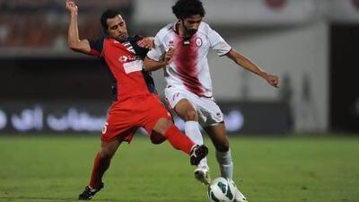 Zayed Al Kathiri of Al Wahda negotiates the ball against Al Shaab.