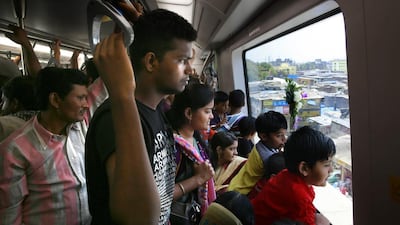 Commuters take the Mumbai metro on the first day of its opening. The metro line is expected to carry about 11,00,000 passengers every day, with at least 1,500 passengers per train. Rafiq Maqbool / AP Photo