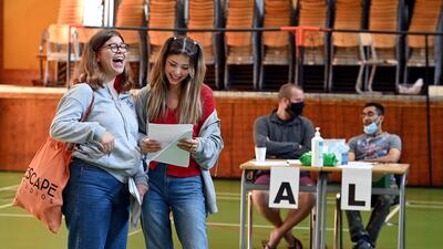 Students react after receiving their A-level exam results at Kingsdale Foundation school in London, Britain, August 10. EPA